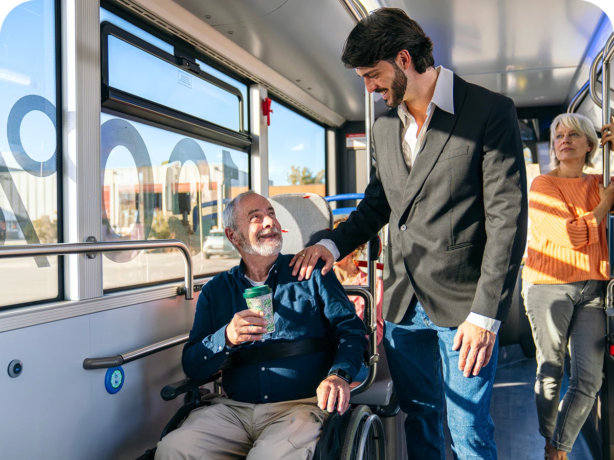 Man in wheelchair talking to standing man.