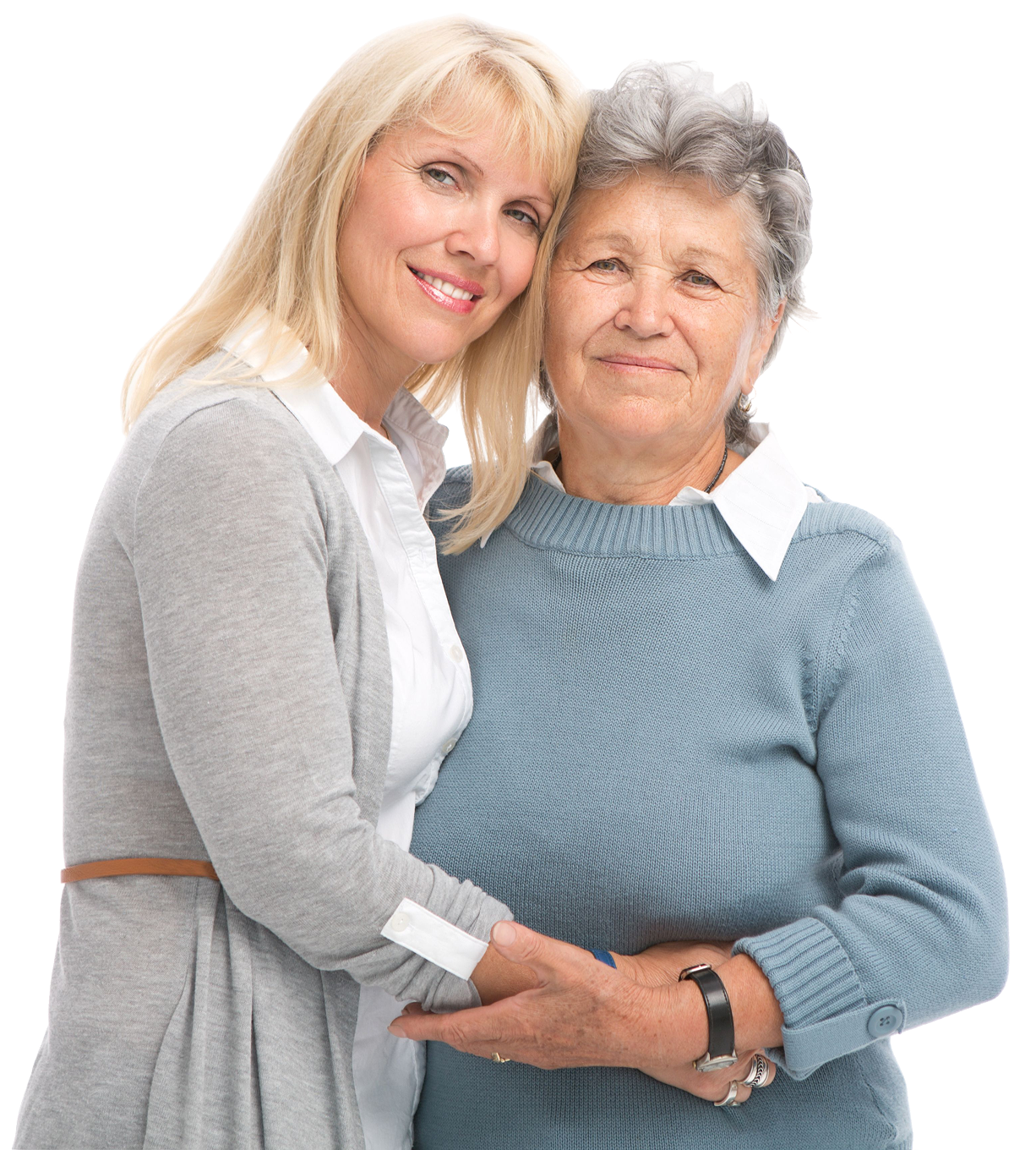Two women embracing, smiling at camera.