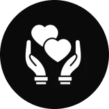 Hands holding two hearts on black background.
